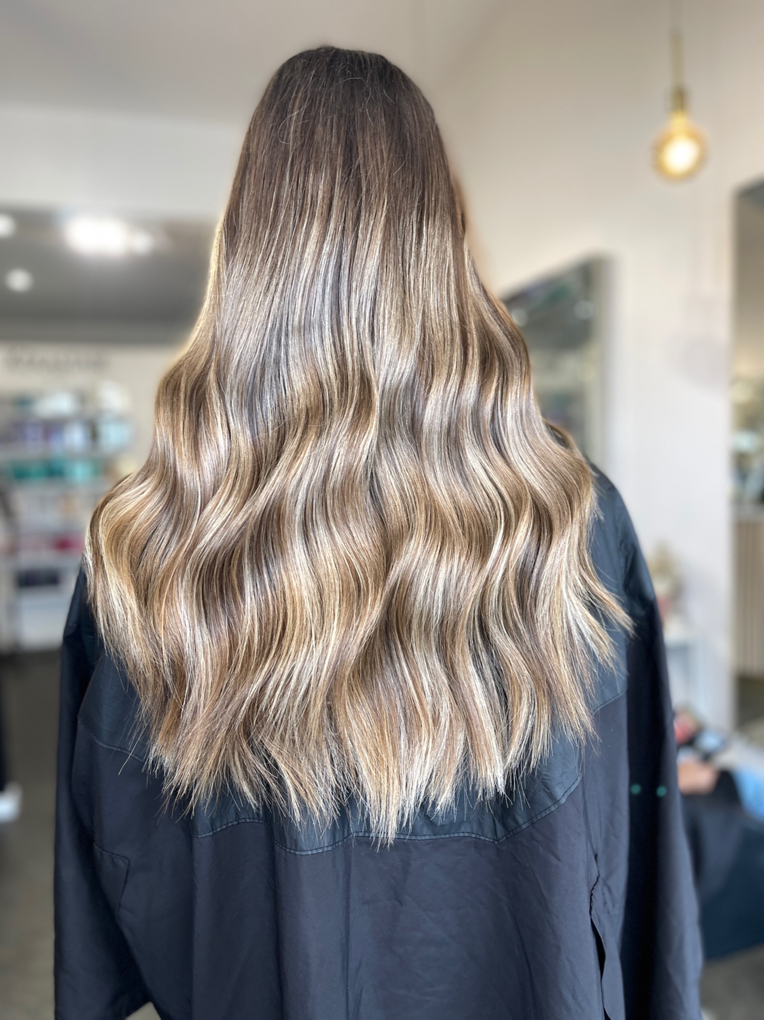 Soft, blended balayage on long hair at Elite Hair